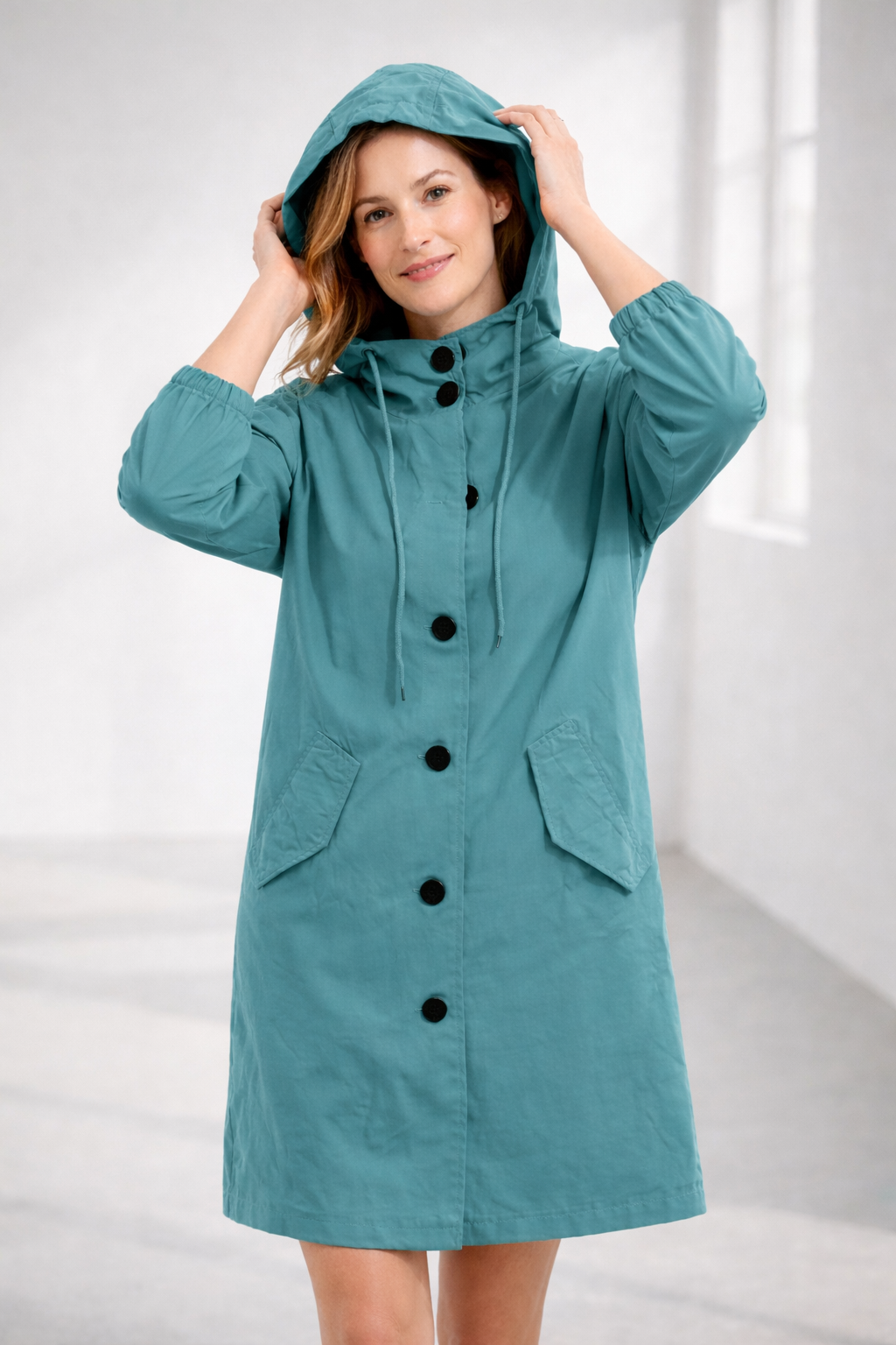 Mid-Length Hooded Jacket with Button Front and Shortened Sleeves Modeberg Bern